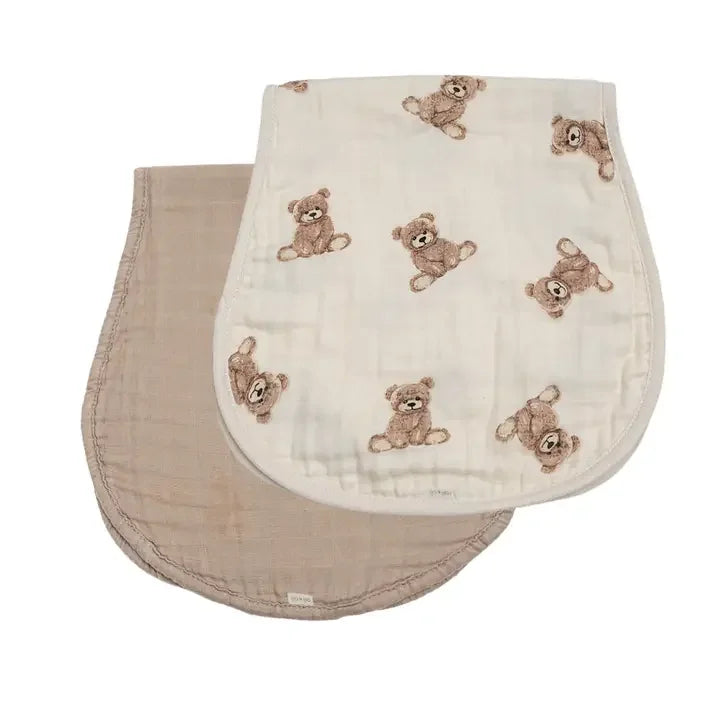 Two bamboo muslin burp cloths, one taupe and one with teddy bear print, side by side.