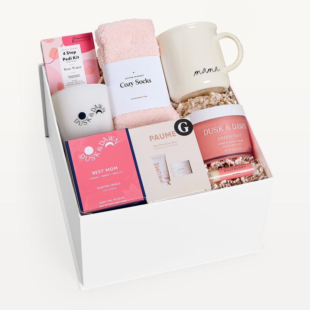 Best Mom Ever Deluxe, white gift box, lid off. Mama mug, pink Cozy Socks, Dusk & Dawn Best Mom candle, 4 Step Pedi Kit, Paume, Grapefruit body butter. Giften Market.