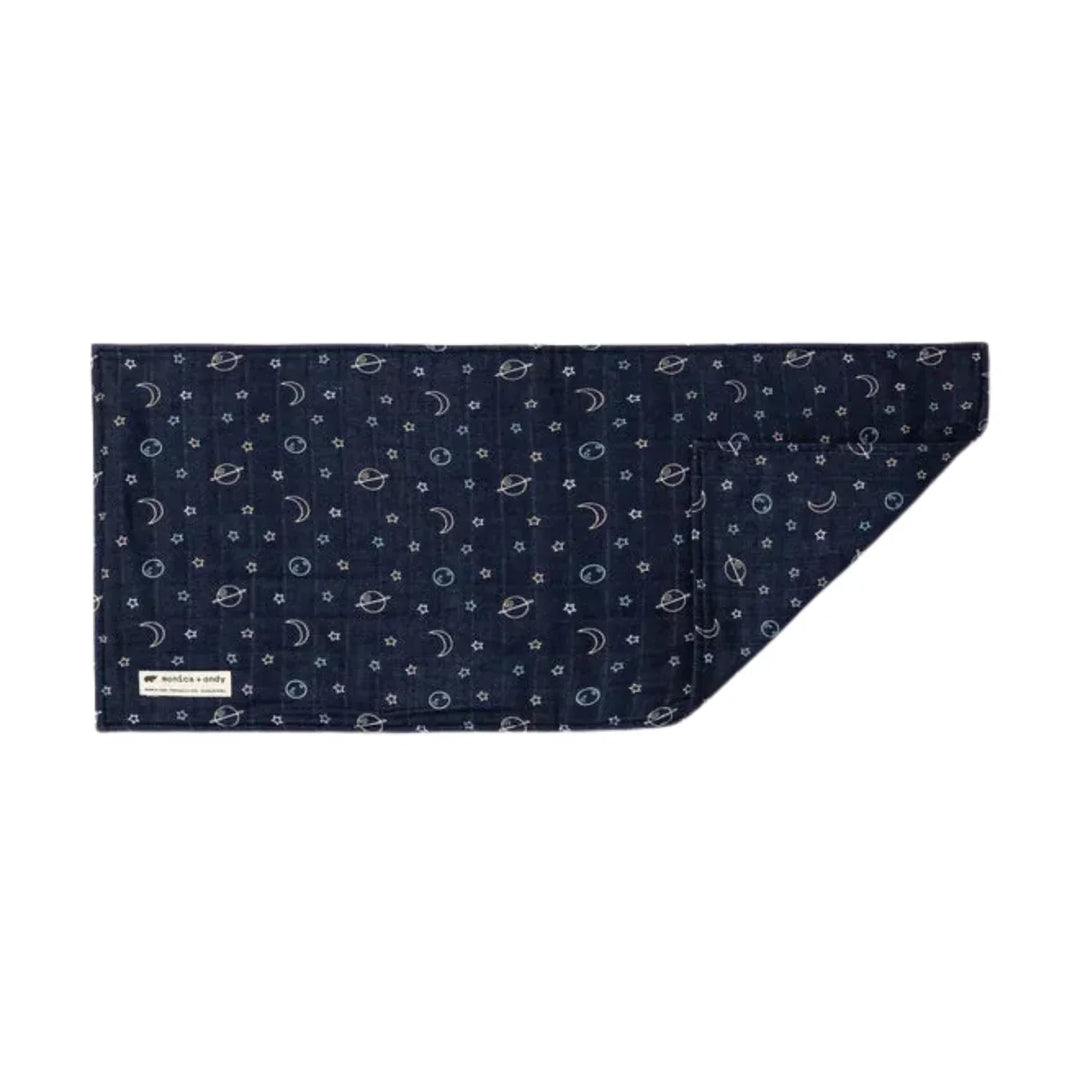 Navy muslin baby burp cloth with moon, star, and planet pattern folded flat