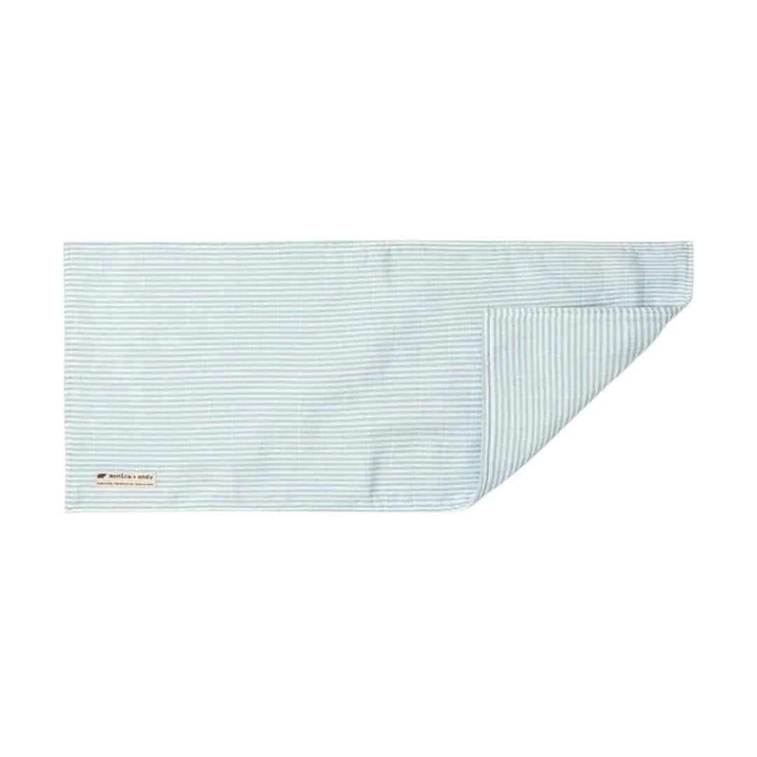 Blue striped muslin baby burp cloth with folded corner and subtle fabric label