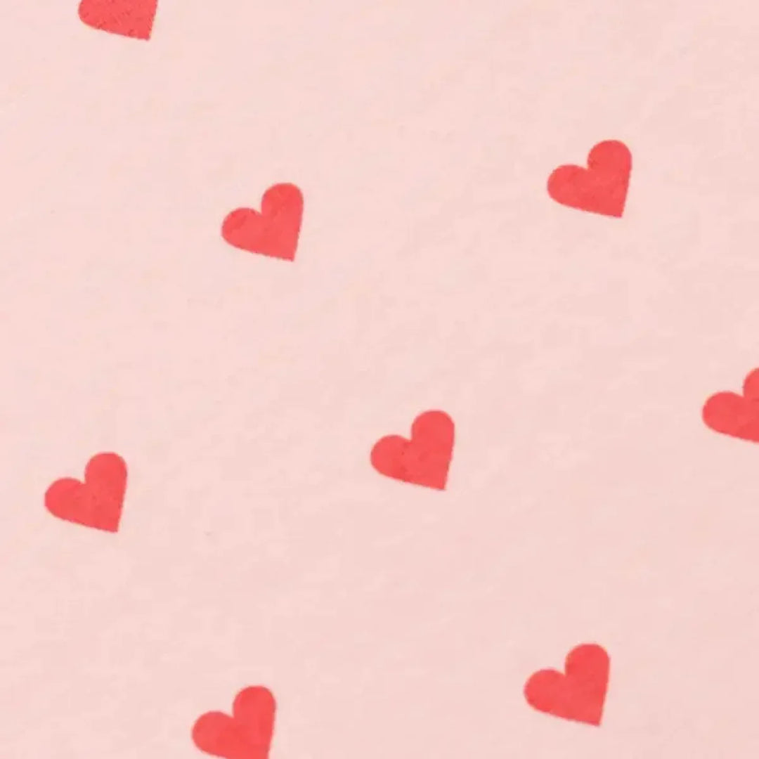 Soft pink baby blanket with red heart pattern, ideal for newborn gifting