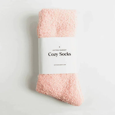Cozy Cloud Socks in seashell pink folded with the Giften Market Cozy Socks band