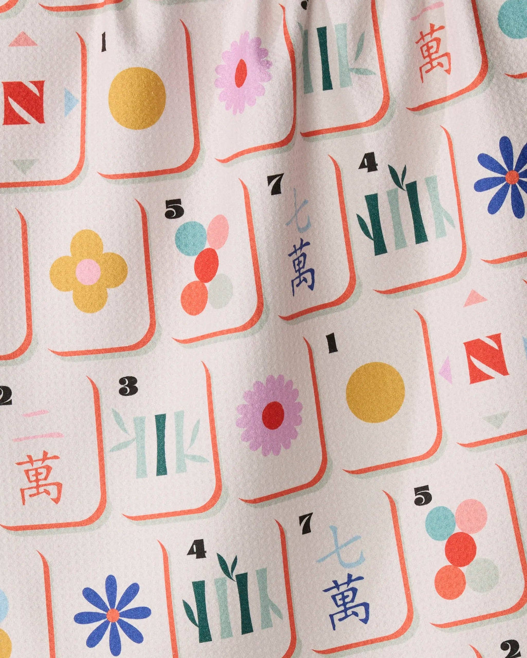 Tile Toss tea towel hanging in a kitchen