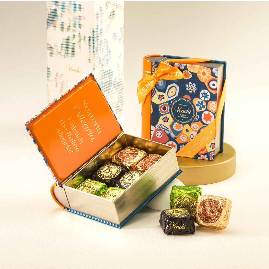 Venchi Murrine Mini Book Box, a book-shaped tin with a colorful murrine glass pattern