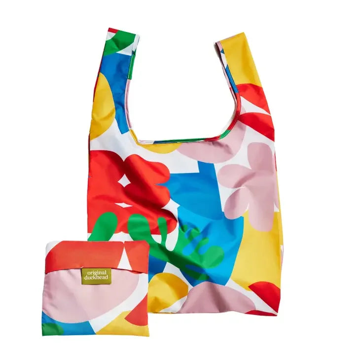 Reusable shopping bag with colorful abstract floral print and matching storage pouch