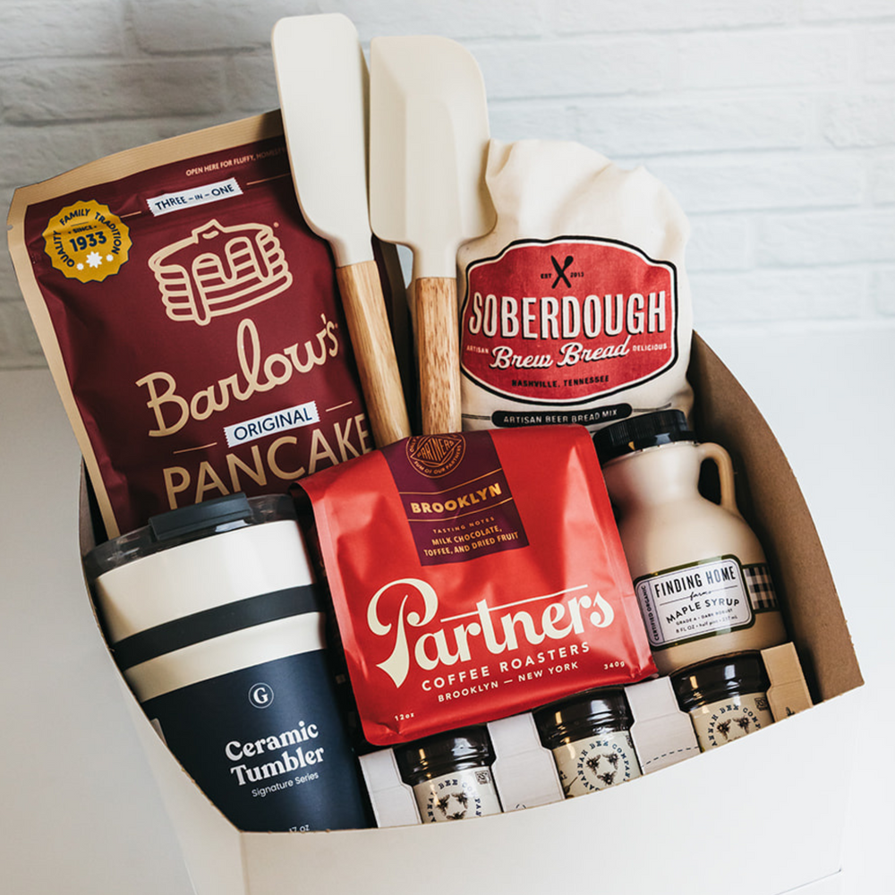 Gift box with baking and coffee items including Barlow's Pancake Mix, Soberdough Bread Mix, and Partners Coffee Roasters.
