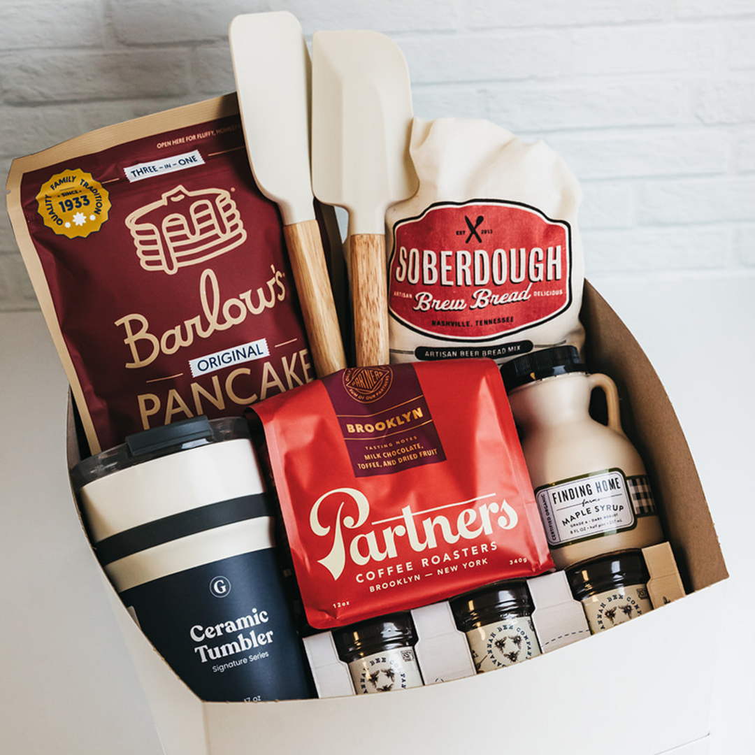 Gift box with baking and coffee items including Barlow's Pancake Mix, Soberdough Bread Mix, and Partners Coffee Roasters.