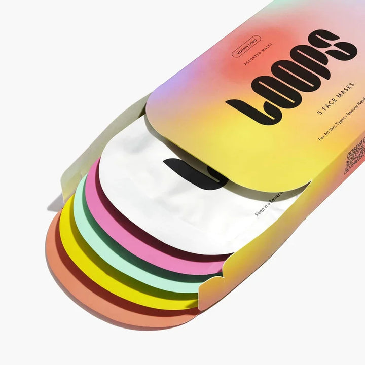 Variety pack of sheet face masks in colorful packaging, five individually wrapped masks shown