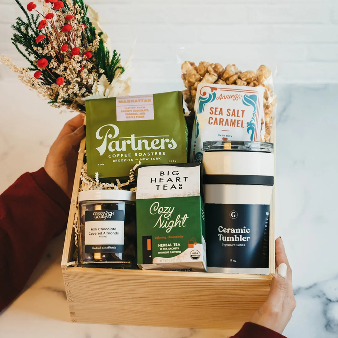 Luxury Coffee Break Crate - Festive: wooden crate with Partners coffee, Big Heart Tea, sea salt caramel popcorn, chocolate almonds, cream ceramic tumbler, and a holly bouquet