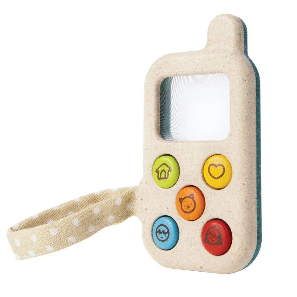 Toy phone with colorful buttons on a white background
