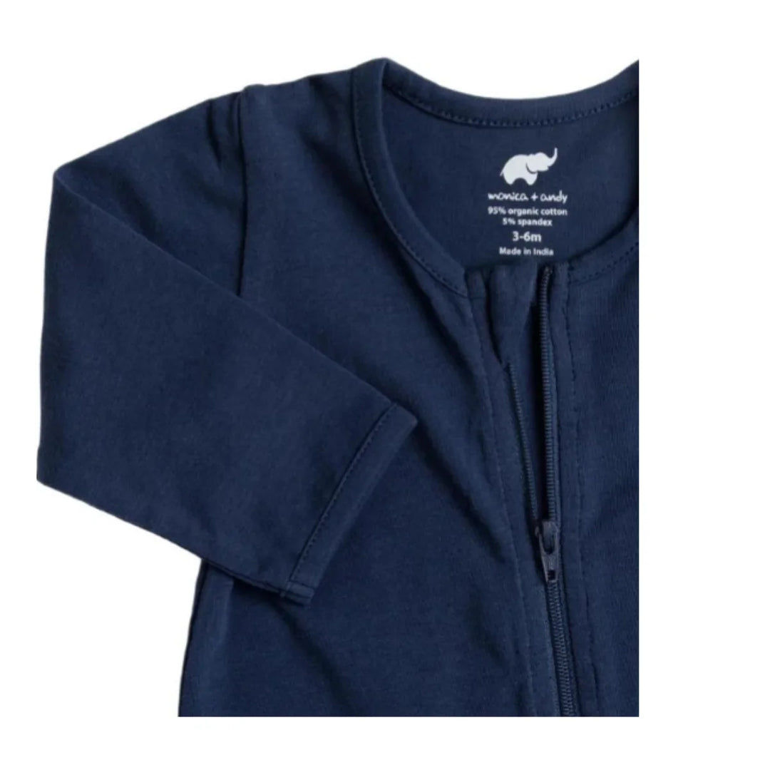 Navy organic cotton baby sleepwear with zipper closure, shown in close-up