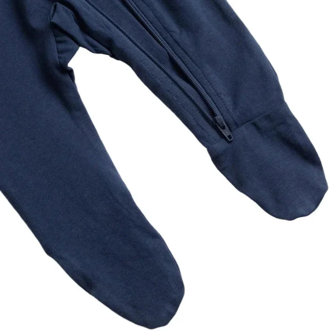 Navy blue footed baby pajamas with front zipper detail on white background