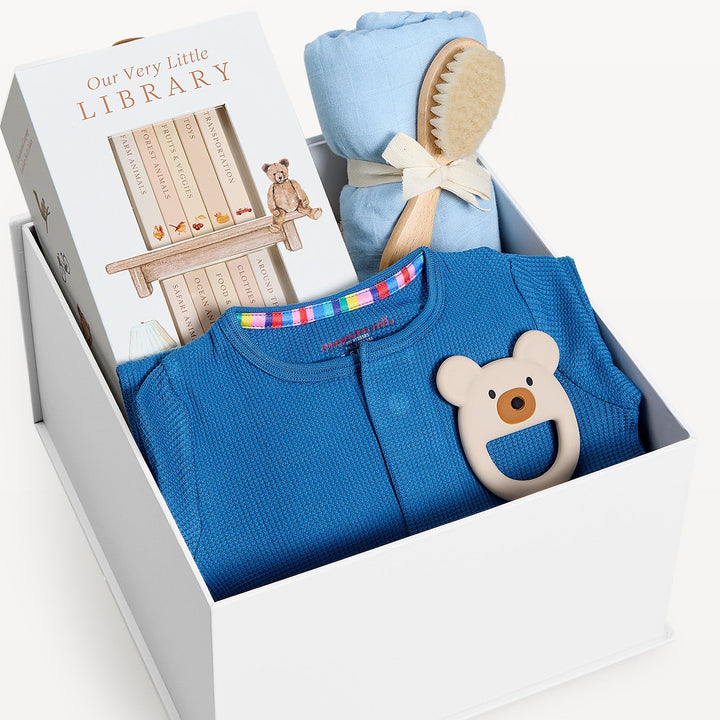 Sweet Beginnings Baby Gift Box Blue Waffle, close-up of the open gift box. Giften Market.