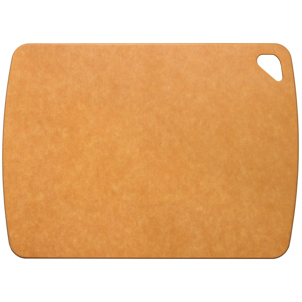 Rectangular brown wood fiber composite cutting board with rounded edges and corner cutout