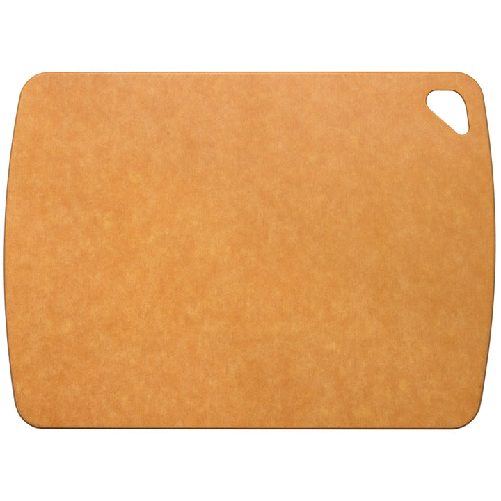 Rectangular brown wood fiber composite cutting board with rounded edges and corner cutout