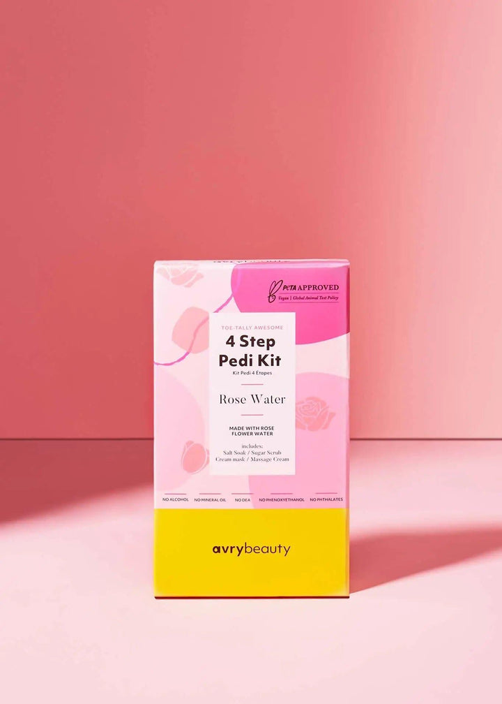 Rose Water 4-step pedi kit box with pink and yellow packaging on a pink background